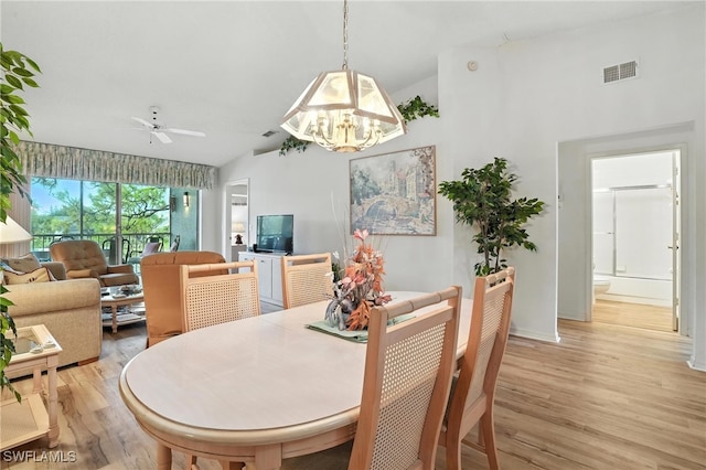 800 New Waterford Dr Unit A202, Naples, FL 34104 - dining space featuring light wood-type flooring, lofted ceiling, a chandelier, and a ceiling fan