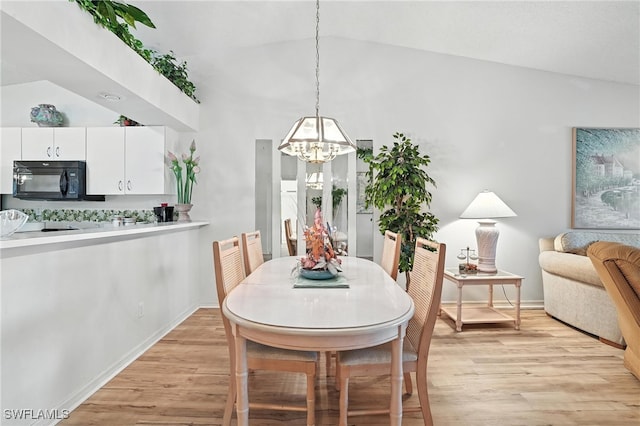 800 New Waterford Dr Unit A202, Naples, FL 34104 - dining room with a chandelier, lofted ceiling, and light wood-style flooring