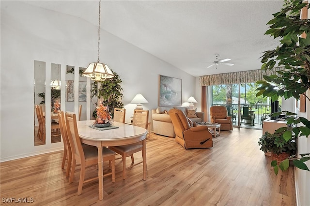 800 New Waterford Dr Unit A202, Naples, FL 34104 - dining room featuring light wood finished floors, lofted ceiling, a ceiling fan, and a chandelier