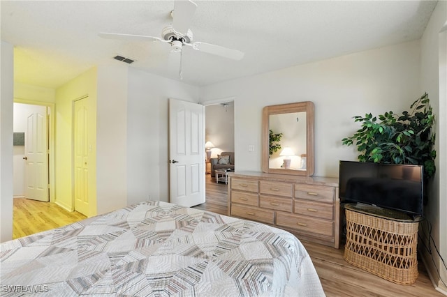 800 New Waterford Dr Unit A202, Naples, FL 34104 - bedroom featuring light wood-type flooring and a ceiling fan