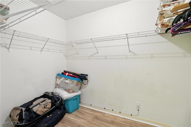 800 New Waterford Dr Unit A202, Naples, FL 34104 - walk in closet featuring wood finished floors