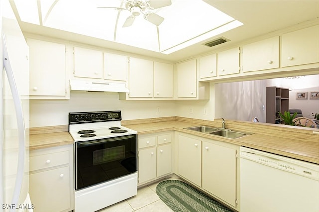 1733 Courtyard Way Unit B205, Naples, FL 34112 - kitchen featuring white appliances, under cabinet range hood, light countertops, a ceiling fan, and light tile patterned flooring