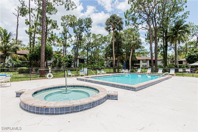 1733 Courtyard Way Unit B205, Naples, FL 34112 - community pool with a hot tub and a patio area