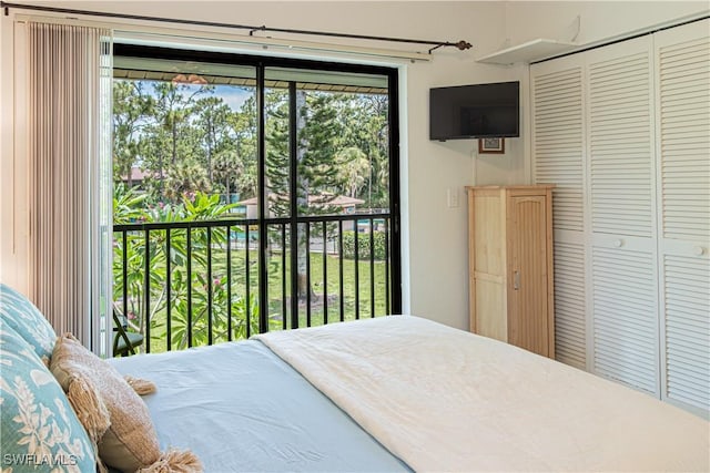 1733 Courtyard Way Unit B205, Naples, FL 34112 - bedroom featuring access to exterior and a closet