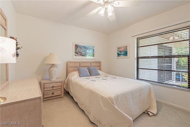 1733 Courtyard Way Unit B205, Naples, FL 34112 - bedroom with light colored carpet and a ceiling fan