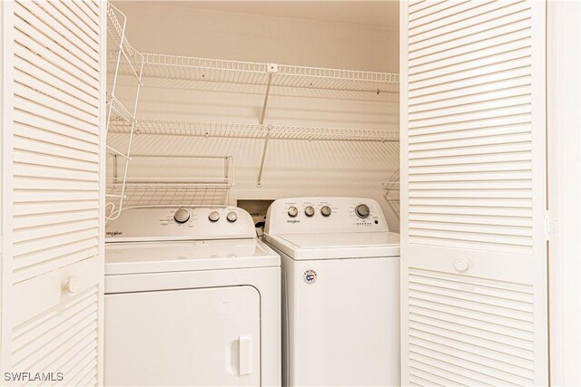 1733 Courtyard Way Unit B205, Naples, FL 34112 - laundry room with washing machine and clothes dryer