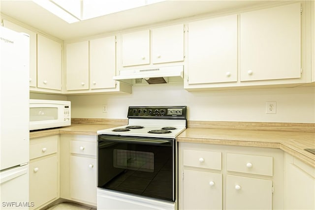 1733 Courtyard Way Unit B205, Naples, FL 34112 - kitchen featuring white appliances, under cabinet range hood, and light countertops
