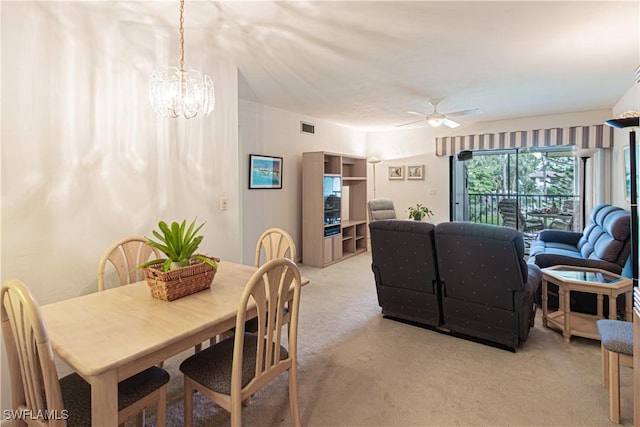 1733 Courtyard Way Unit B205, Naples, FL 34112 - dining space featuring light carpet, a ceiling fan, and a chandelier
