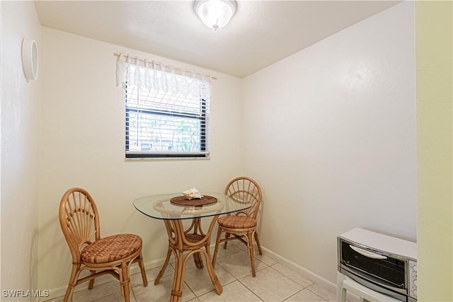 1733 Courtyard Way Unit B205, Naples, FL 34112 - dining area with light tile patterned floors and heating unit