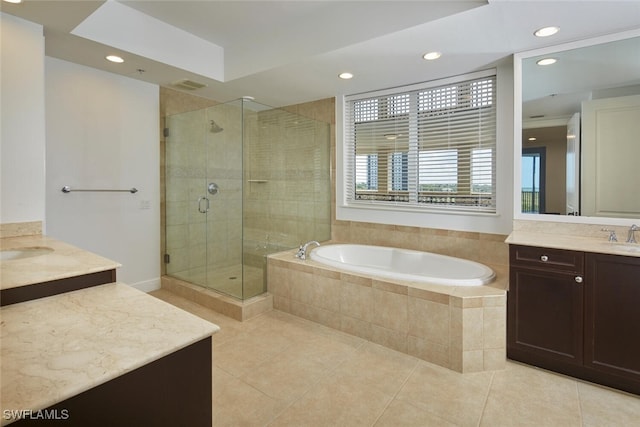 24011 Via Castella Dr Unit 2402, Bonita Springs, FL 34134 - bathroom featuring tile patterned floors, two vanities, a shower stall, a bath, and recessed lighting