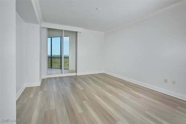 24011 Via Castella Dr Unit 2402, Bonita Springs, FL 34134 - empty room with light wood-style flooring, floor to ceiling windows, and crown molding
