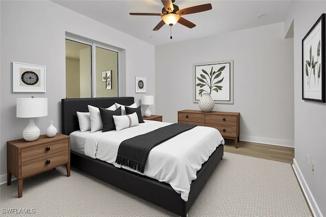 24011 Via Castella Dr Unit 2402, Bonita Springs, FL 34134 - bedroom with a ceiling fan and light wood finished floors