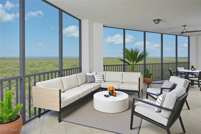 24011 Via Castella Dr Unit 2402, Bonita Springs, FL 34134 - sunroom / solarium with expansive windows, outdoor lounge area, healthy amount of natural light, a ceiling fan, and tile patterned floors