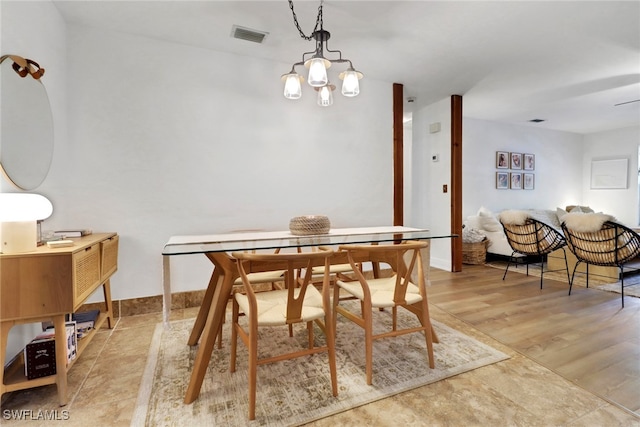 3110 10th Ave SE, Naples, FL 34117 - dining space featuring baseboards and a chandelier
