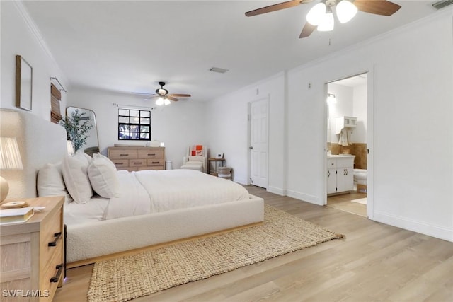 3110 10th Ave SE, Naples, FL 34117 - bedroom with light wood-style floors, crown molding, ceiling fan, and ensuite bath