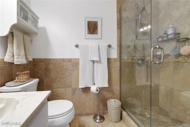 3110 10th Ave SE, Naples, FL 34117 - bathroom with vanity, tiled shower, tile walls, and wainscoting