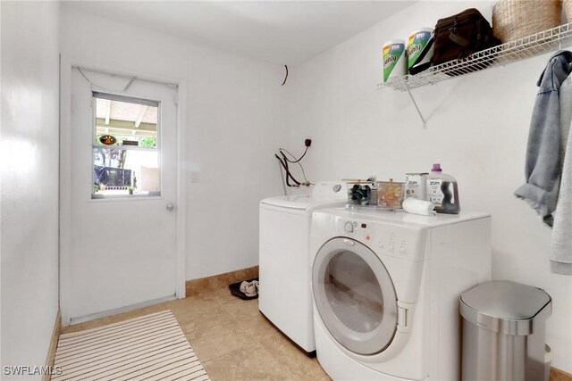 3110 10th Ave SE, Naples, FL 34117 - laundry room with independent washer and dryer and light tile patterned flooring
