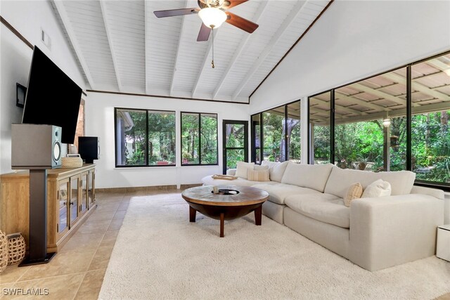 3110 10th Ave SE, Naples, FL 34117 - living area featuring light tile patterned floors, ceiling fan, a wood ceiling with exposed beams, and high vaulted ceiling