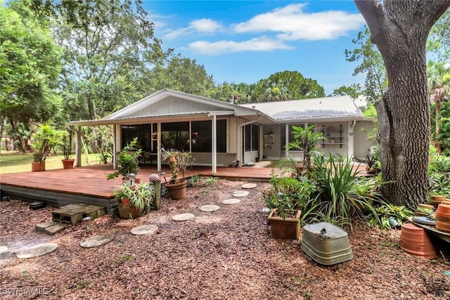 3110 10th Ave SE, Naples, FL 34117 - back of property featuring a deck and a sunroom