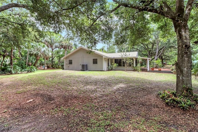 3110 10th Ave SE, Naples, FL 34117 - rear view of property featuring a carport and a yard