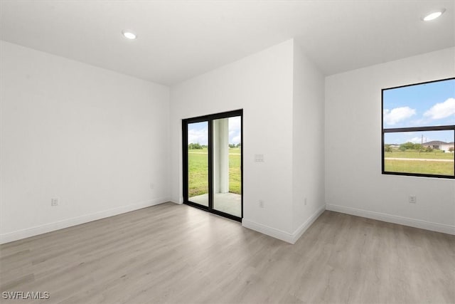 9013 Largo Cir, Labelle, FL 33935 - spare room with plenty of natural light, light wood-type flooring, and recessed lighting