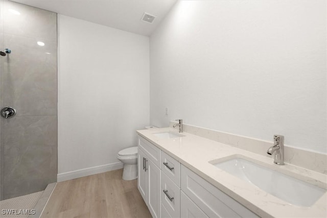 9013 Largo Cir, Labelle, FL 33935 - full bathroom with a walk in shower, double vanity, and wood finished floors