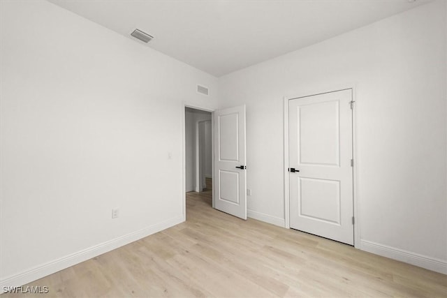 9013 Largo Cir, Labelle, FL 33935 - unfurnished bedroom with light wood-type flooring