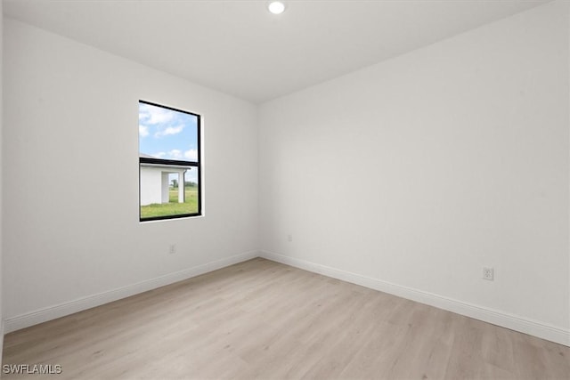 9013 Largo Cir, Labelle, FL 33935 - empty room with light wood-type flooring and recessed lighting