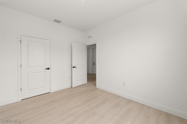 9013 Largo Cir, Labelle, FL 33935 - unfurnished bedroom featuring light wood-type flooring and baseboards
