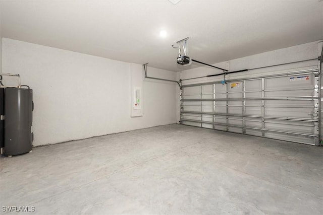 9013 Largo Cir, Labelle, FL 33935 - garage with water heater, a garage door opener, and electric panel