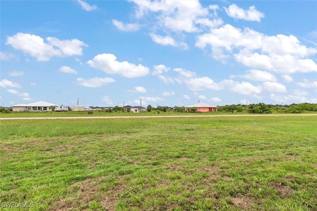 9013 Largo Cir, Labelle, FL 33935 - view of grassy yard featuring a view of countryside