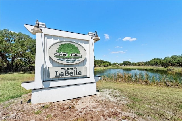9013 Largo Cir, Labelle, FL 33935 - community sign with a water view and a yard