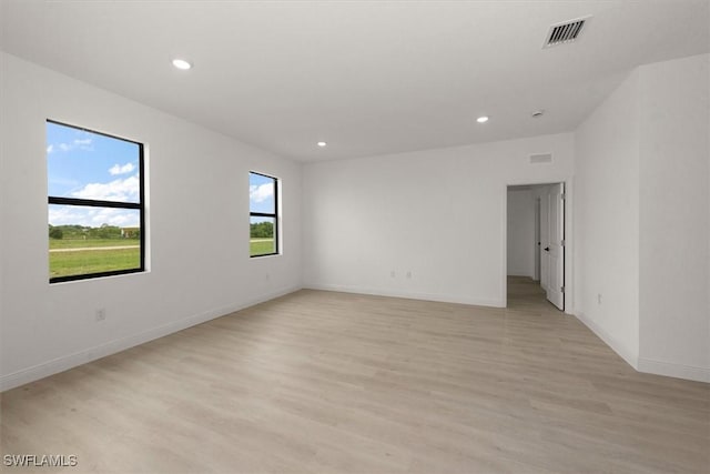 9013 Largo Cir, Labelle, FL 33935 - empty room with light wood-style flooring and recessed lighting