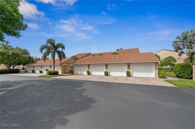 2370 Magnolia Ave Unit 6807, Naples, FL 34112 - single story home featuring community garages, a tiled roof, and stucco siding