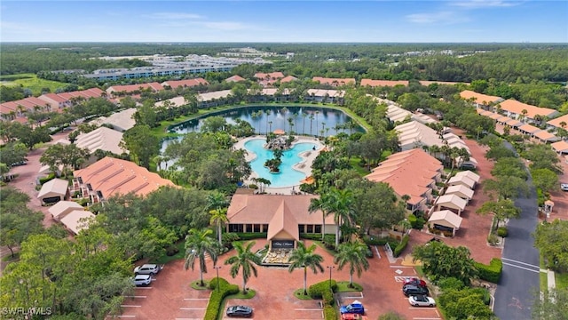 2370 Magnolia Ave Unit 6807, Naples, FL 34112 - drone / aerial view of a pool area and a large body of water