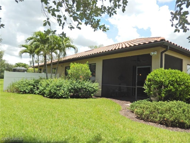 11775 Avingston Ter, Fort Myers, FL 33913 - view of home's exterior featuring a tiled roof, stucco siding, and a sunroom