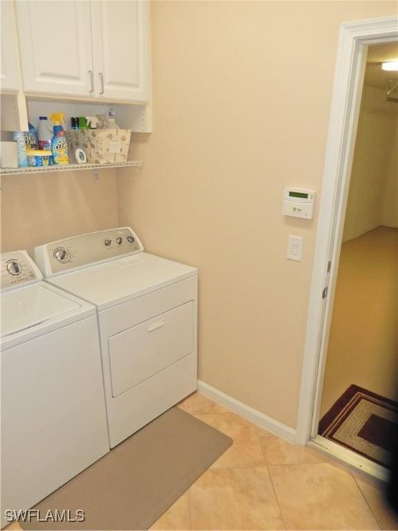 11775 Avingston Ter, Fort Myers, FL 33913 - laundry room featuring separate washer and dryer, cabinet space, and light tile patterned flooring