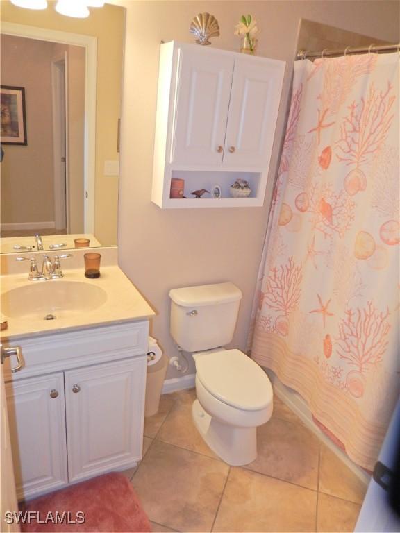 11775 Avingston Ter, Fort Myers, FL 33913 - bathroom with vanity, tile patterned flooring, and a shower with curtain
