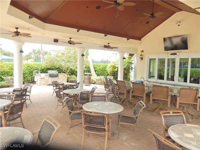 11775 Avingston Ter, Fort Myers, FL 33913 - view of patio / terrace featuring exterior kitchen, ceiling fan, and outdoor dining space