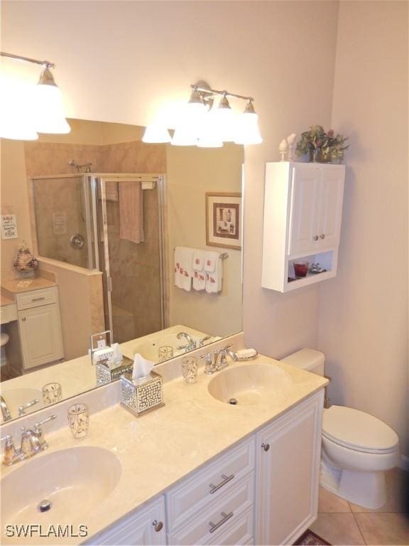11775 Avingston Ter, Fort Myers, FL 33913 - bathroom featuring a shower stall, double vanity, and tile patterned floors
