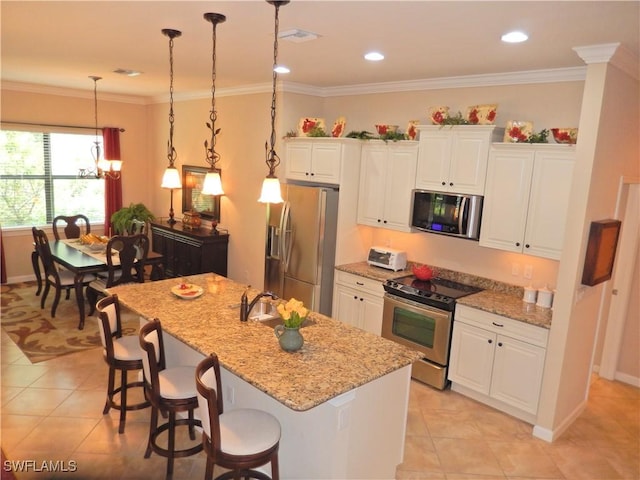 11775 Avingston Ter, Fort Myers, FL 33913 - kitchen featuring appliances with stainless steel finishes, white cabinets, light tile patterned floors, a kitchen breakfast bar, and crown molding