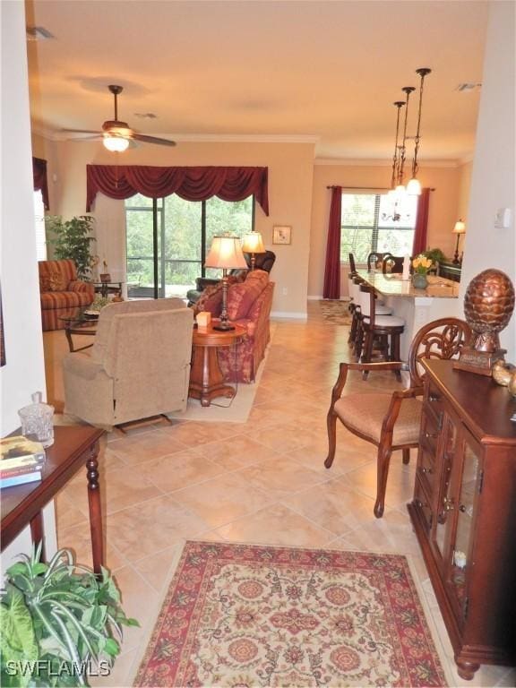 11775 Avingston Ter, Fort Myers, FL 33913 - living room with crown molding, ceiling fan, and light tile patterned floors