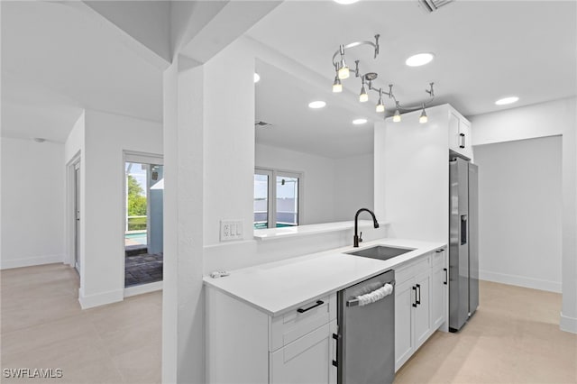 465 Donora Blvd, Fort Myers Beach, FL 33931 - kitchen with stainless steel appliances, white cabinetry, and light countertops
