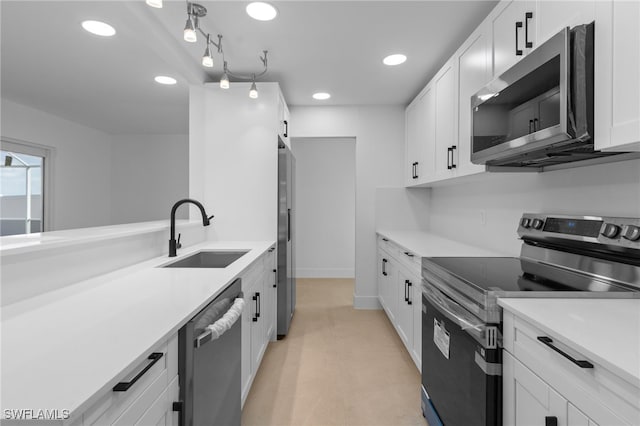 465 Donora Blvd, Fort Myers Beach, FL 33931 - kitchen with stainless steel appliances, recessed lighting, light countertops, and white cabinetry