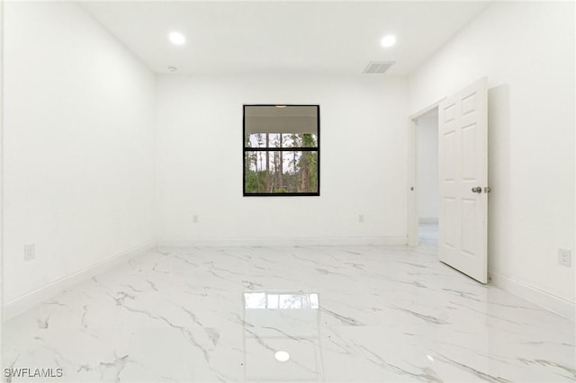 2803 E 13th St, Lehigh Acres, FL 33972 - unfurnished room featuring recessed lighting and marble finish flooring