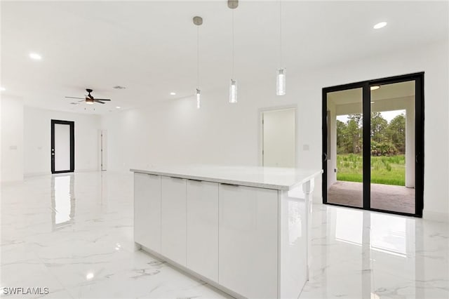 2803 E 13th St, Lehigh Acres, FL 33972 - kitchen with light marble finish floors, white cabinetry, modern cabinets, recessed lighting, and pendant lighting
