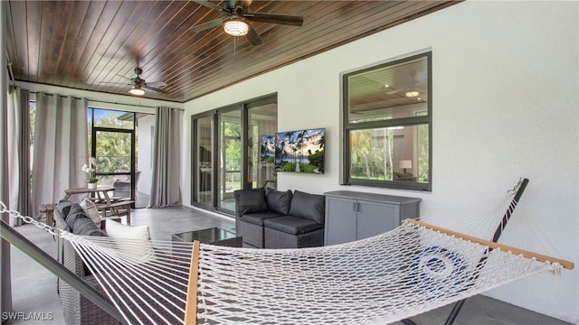 1030 22nd Ave NE, Naples, FL 34120 - sunroom with a ceiling fan, an outdoor living space, and wooden ceiling