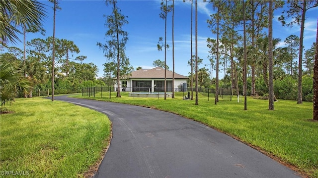 1030 22nd Ave NE, Naples, FL 34120 - view of front facade featuring asphalt driveway