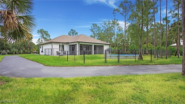 1030 22nd Ave NE, Naples, FL 34120 - view of front facade featuring stucco siding and an attached garage