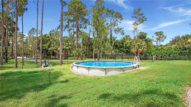 1030 22nd Ave NE, Naples, FL 34120 - view of pool with view of scattered trees
